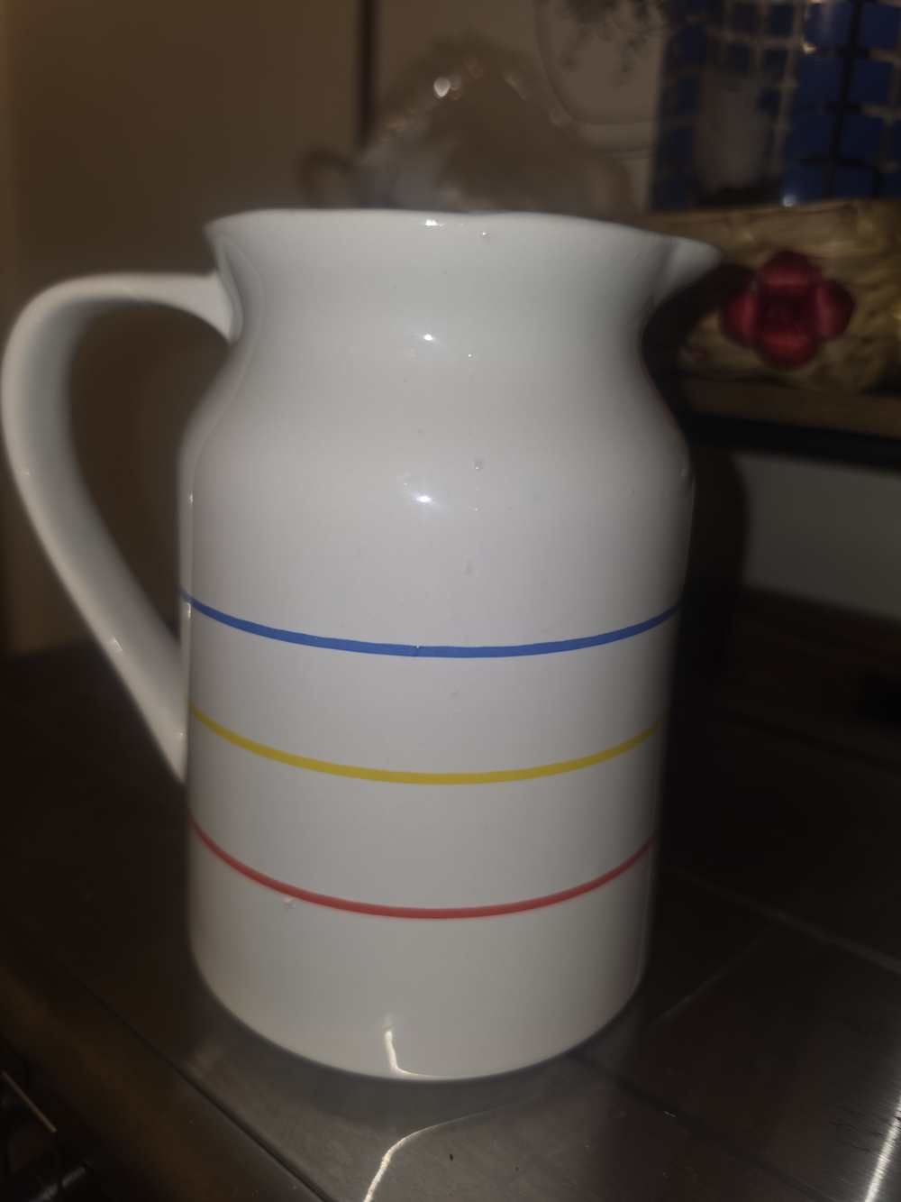 White Ceramic Pitcher with Blue, Yellow and Red Stripes